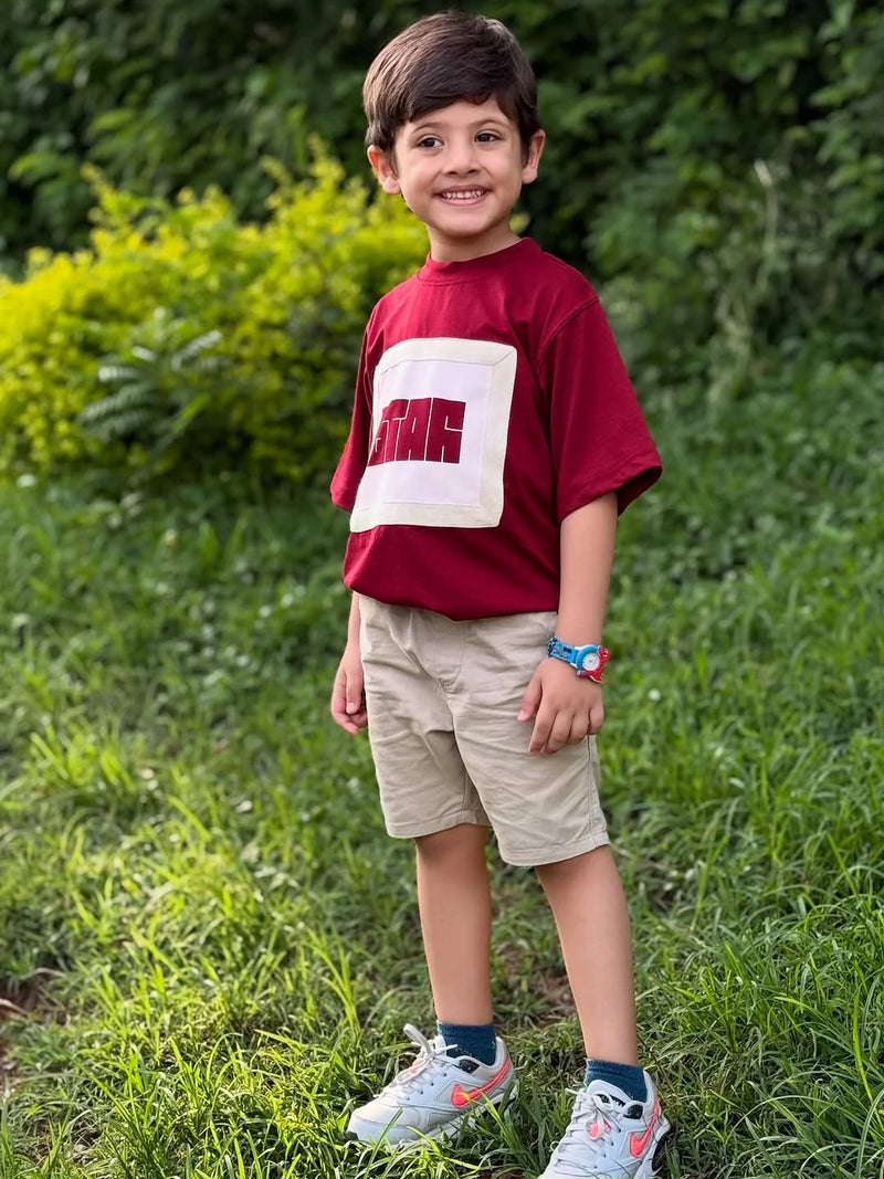 Kid wearing Mama Doura tee