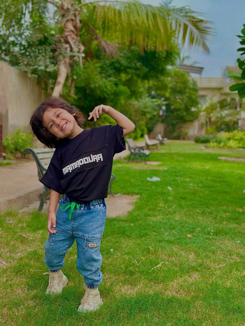 Kid wearing Mama Doura tee