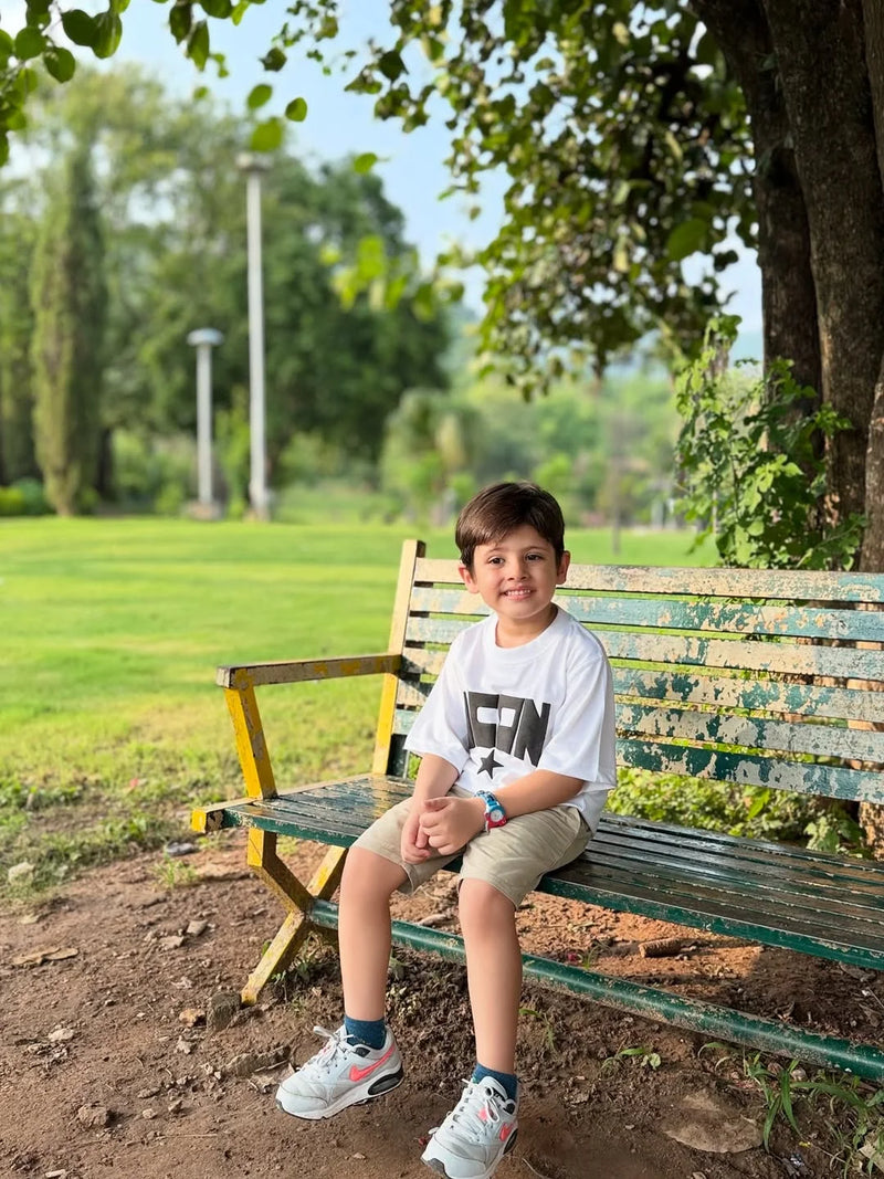 Kid wearing Mama Doura tee